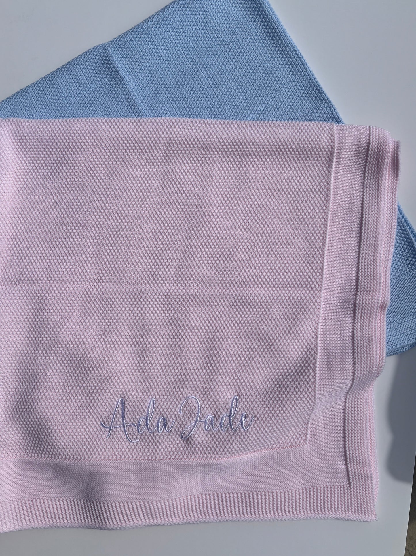 Personalised embroidered knitted blanket
